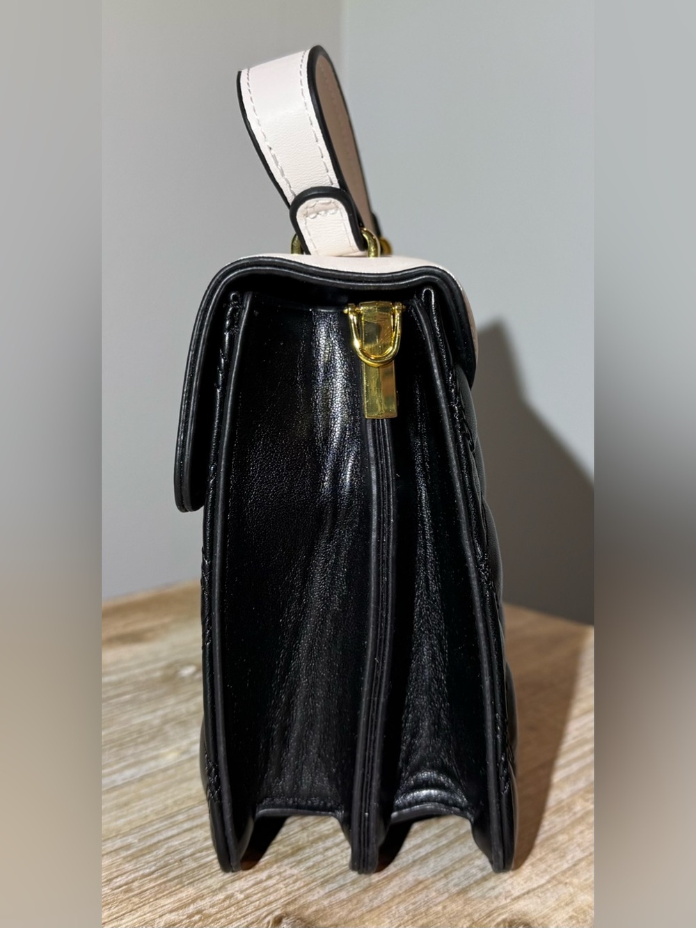White and Black Quilted Top-Handle Bag with Gold Emblem - Picture 4 of 11
